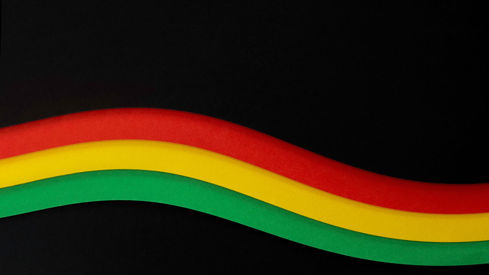 Black background with the Pan-African flag colors.